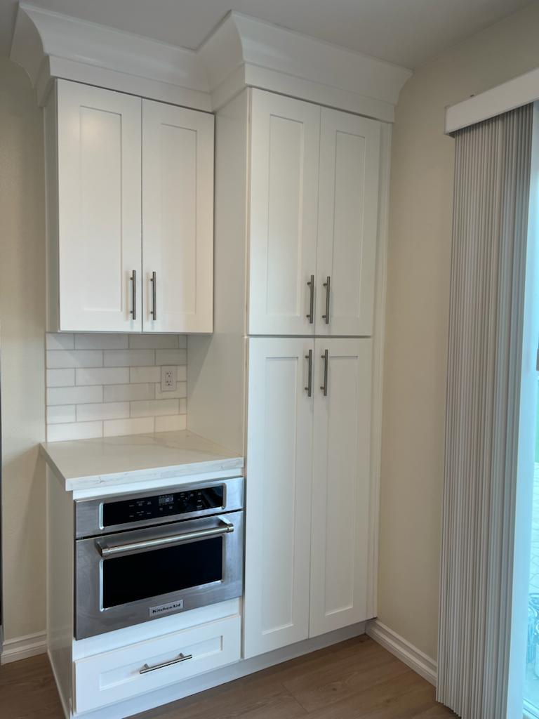 white kitchen cabinet after remodeling
